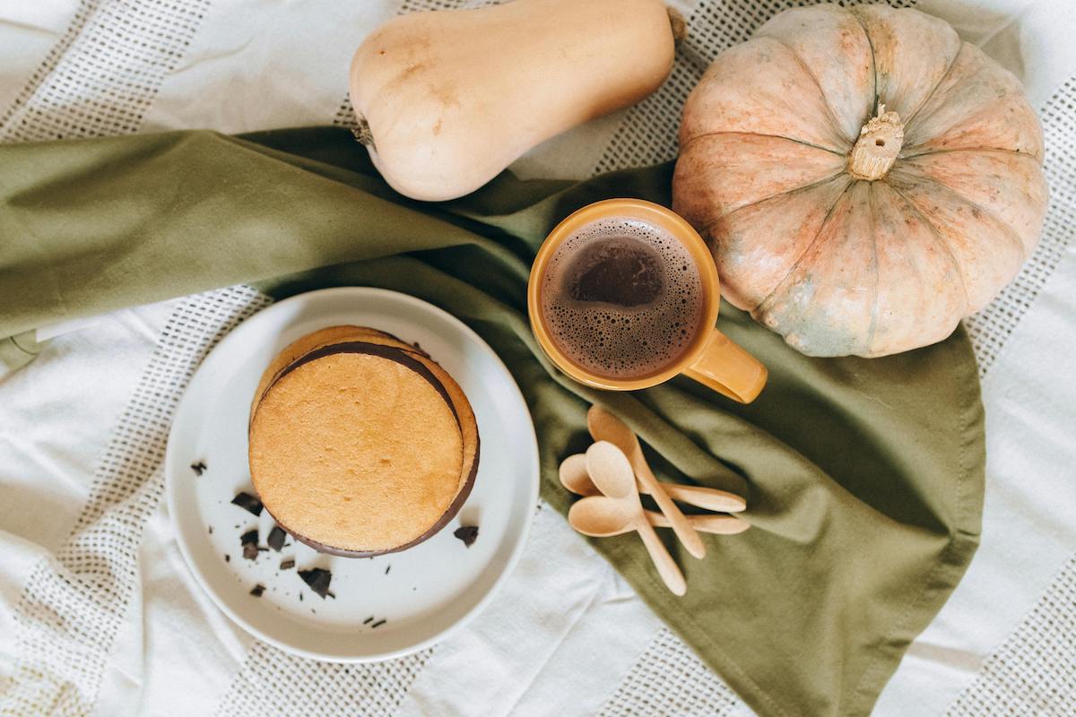 winter squash flat lay with warm beverage