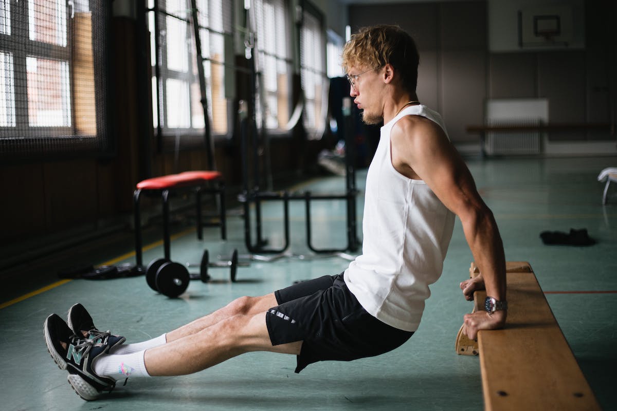 A man doing tricep dips