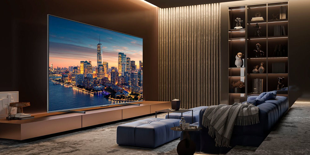 The Hisense 100-inch U76 QLED TV placed in a living room environment.