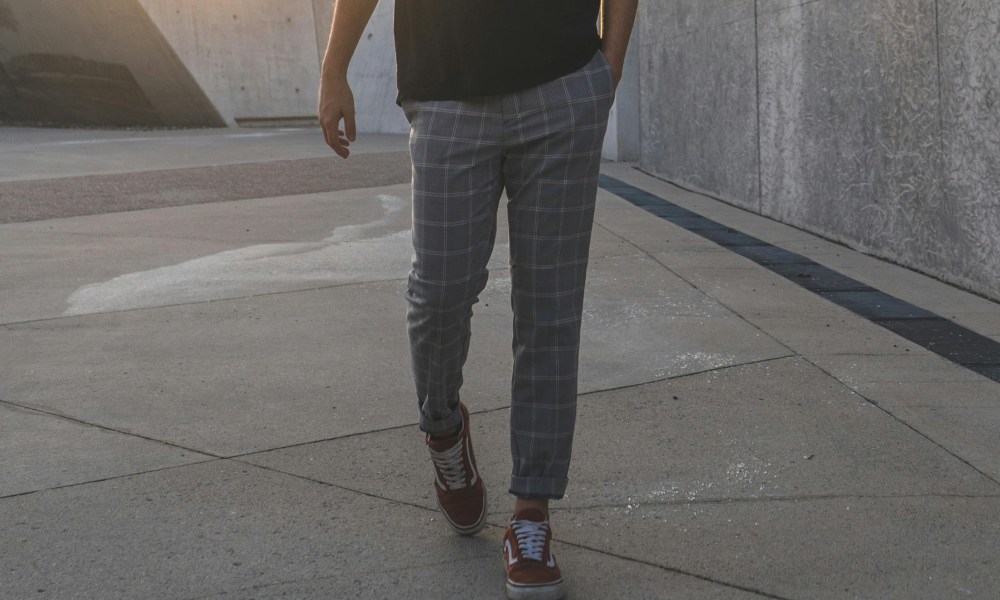 Man in dress pants and sneakers