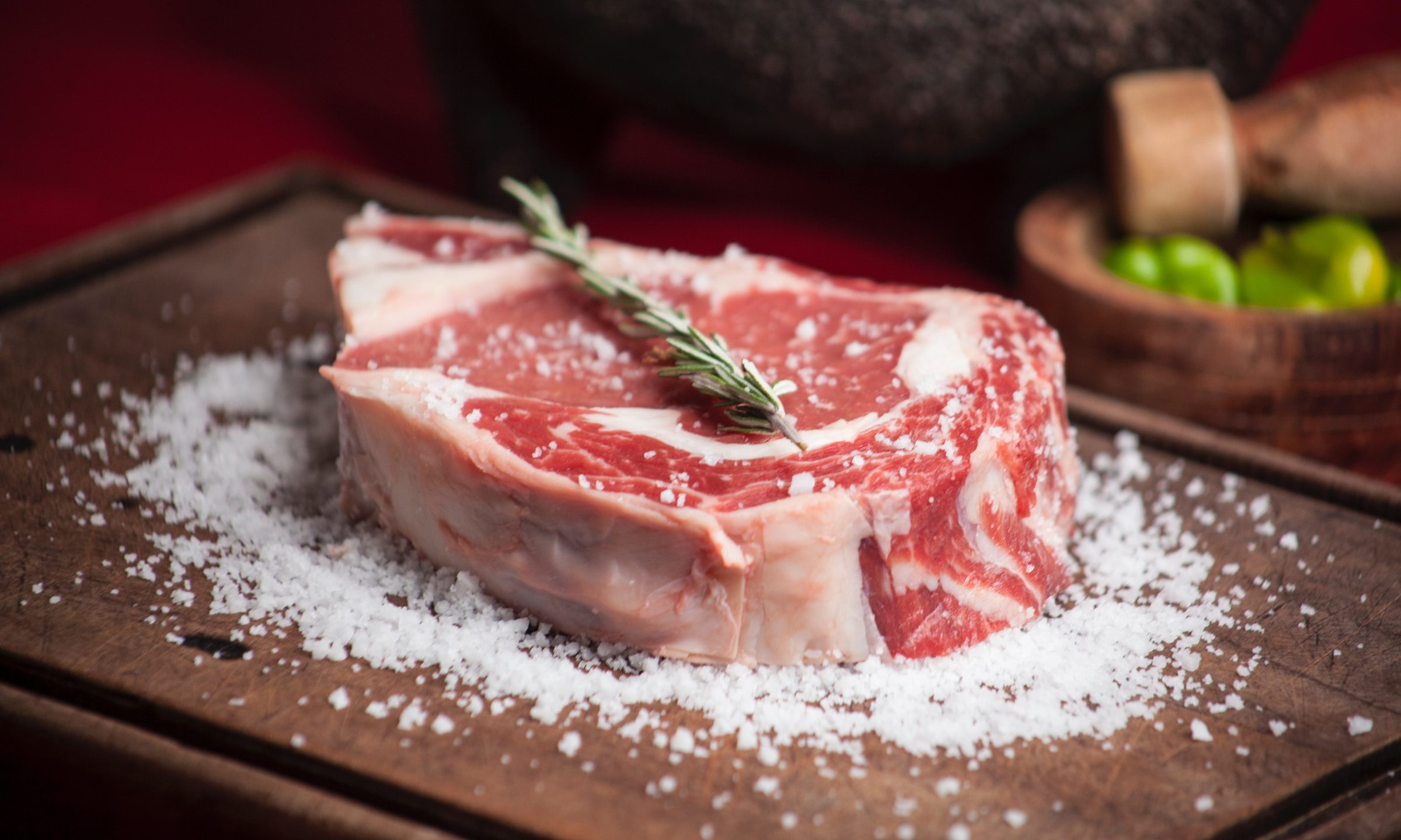 Raw steak on cutting board