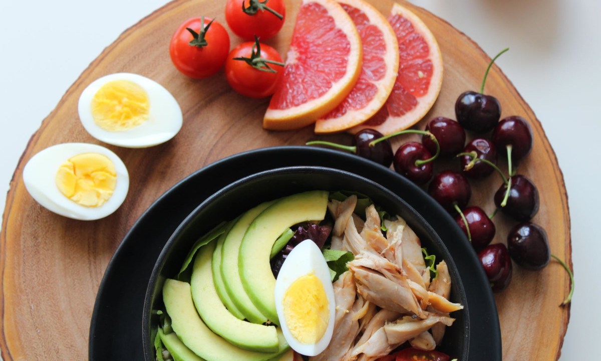 Wooden serving tray of healthy food