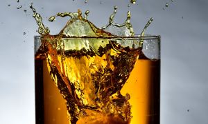 Whiskey splashing from a glass