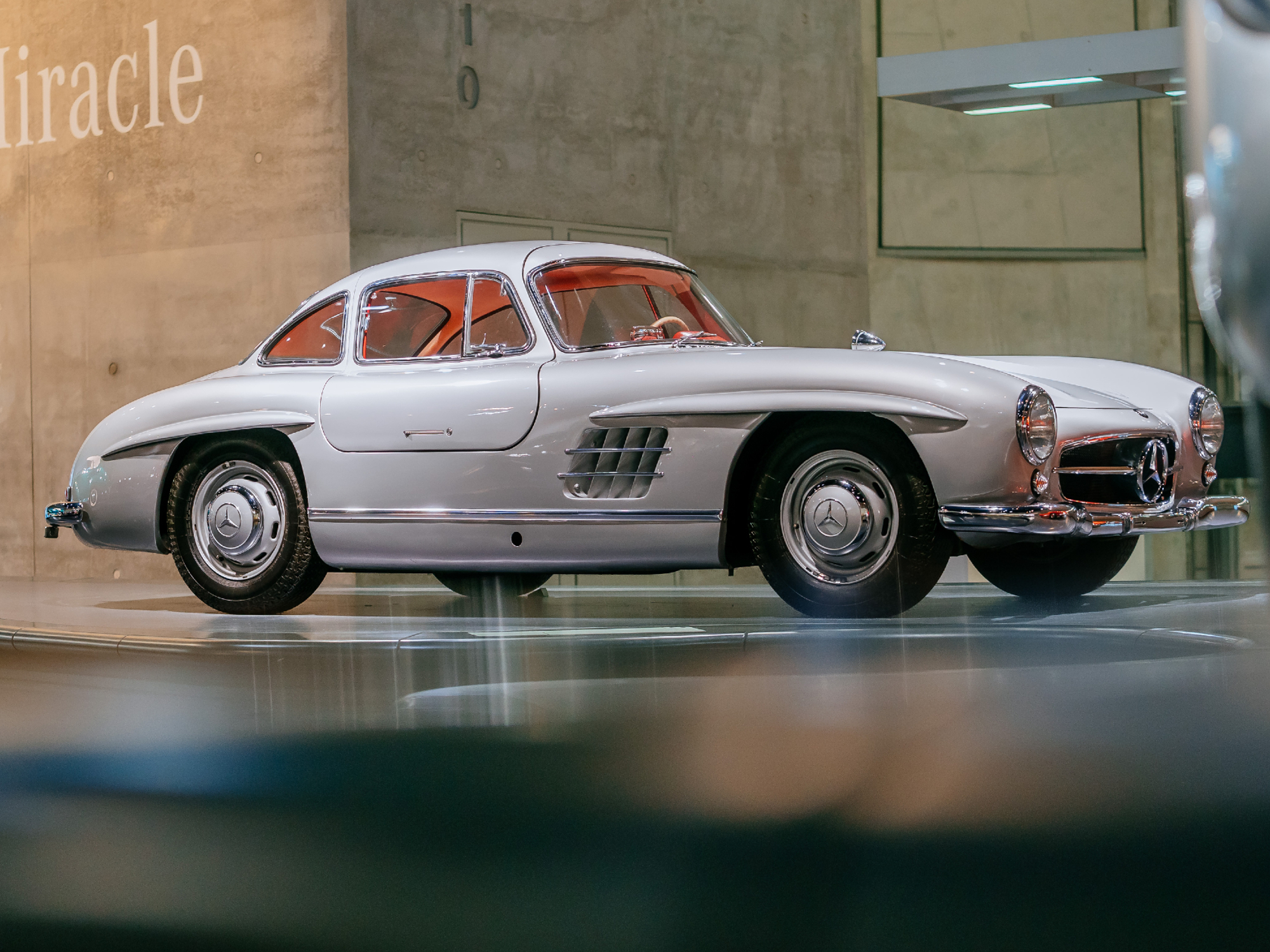 Mercedes-Benz 300 SL Coupe on display at the Mercedes-Benz Museum view from the right side back of the car with gullwing doors closed