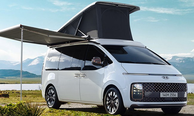 Hyundai Staria Lounge Camper parked in a field.