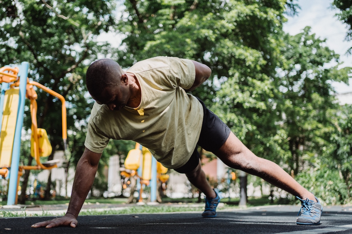 a man on the playground in plank pose