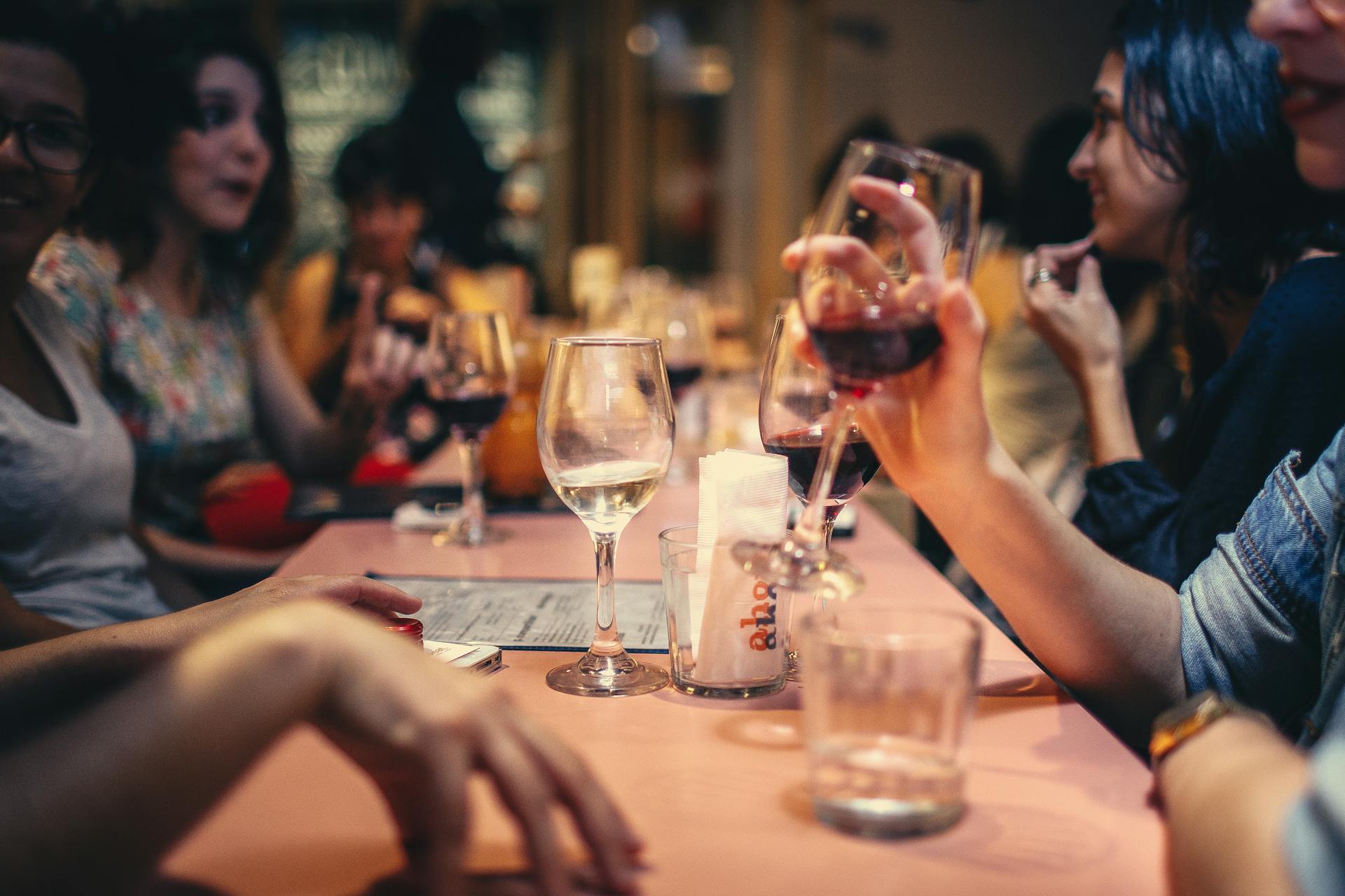 People drinking wine at a table