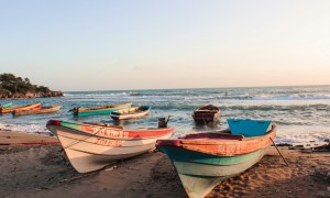 Boats lining Jamaican beach