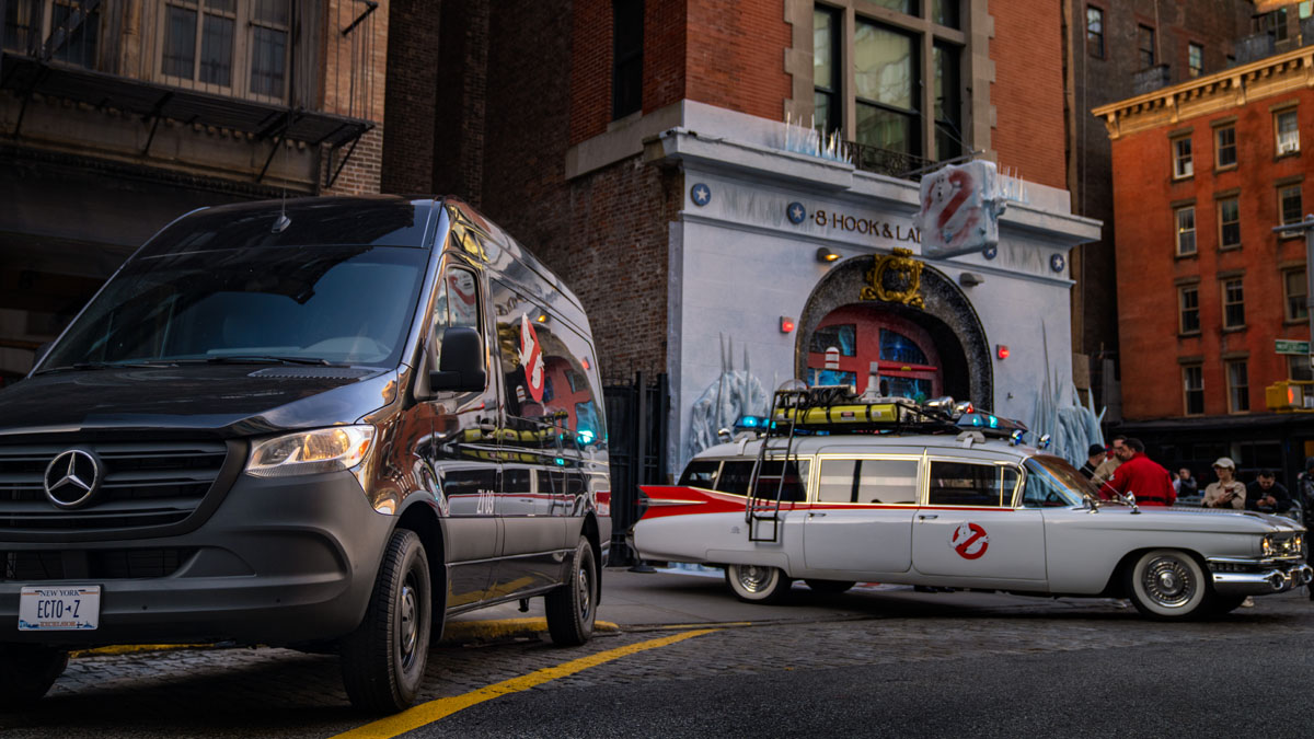 The ECTO-Z and the ECTO-1 parked outside of the Ghostbusters' firehouse.