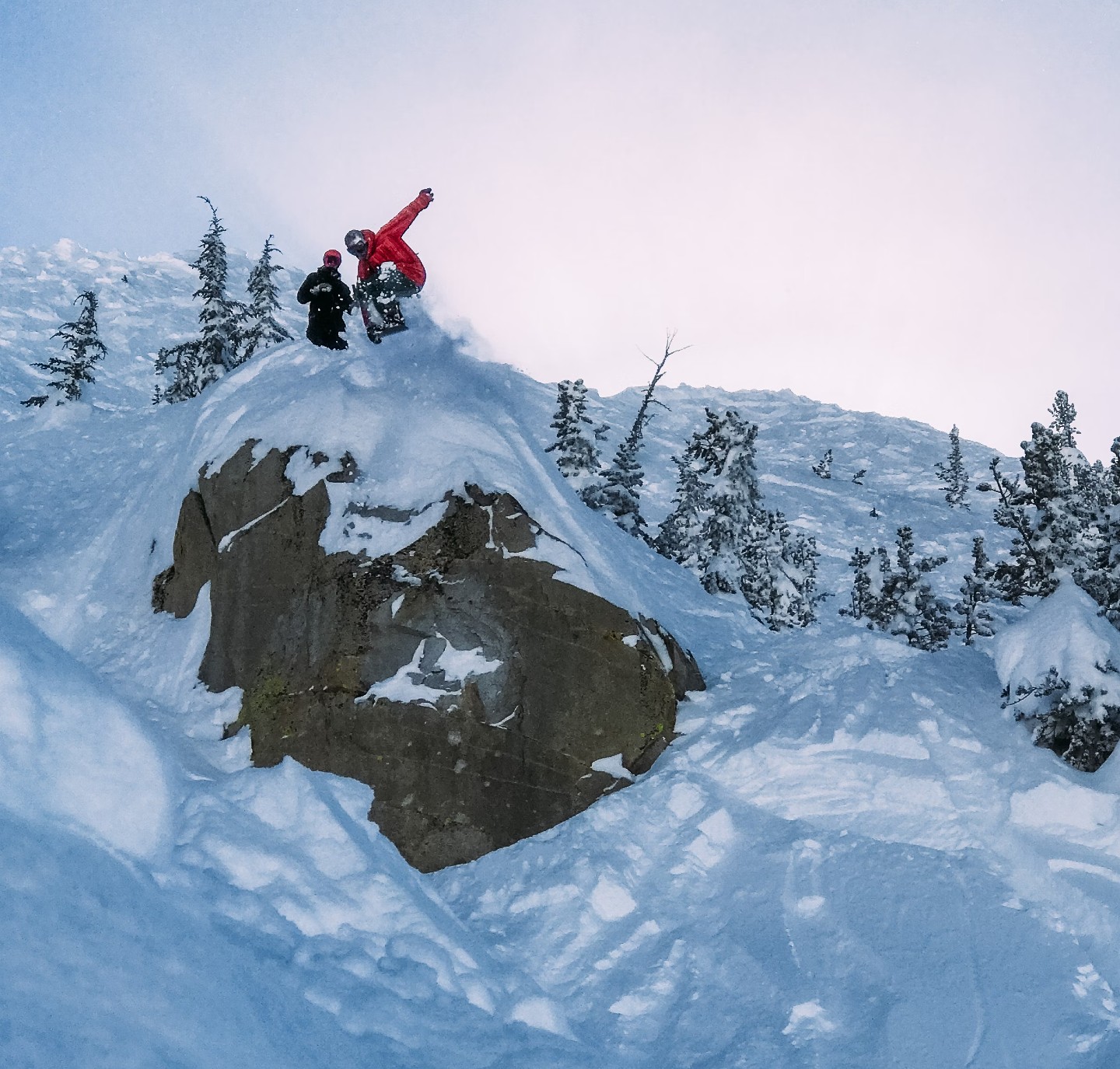 Snowboarder cliff jump at Mammoth