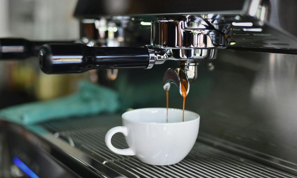 Espresso pouring in a cup