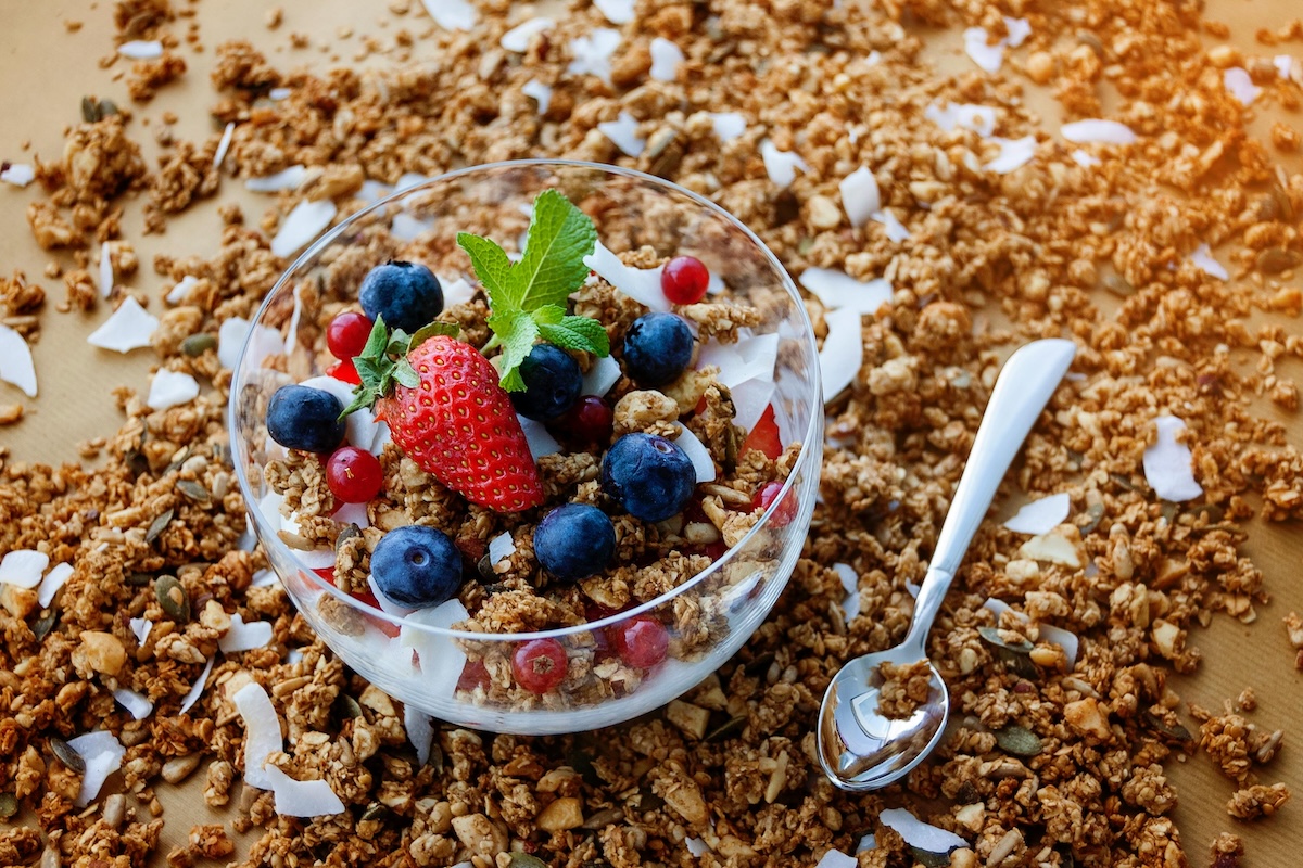 a yogurt parfait with granola and berries