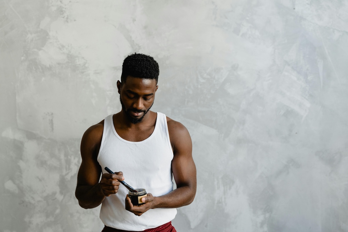 man holding a skincare product