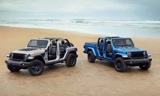 2024 Jeep Wrangler 4xe Beach and 2024 Jeep Gladiator Beach limited-run editions parked on an ocean beach.