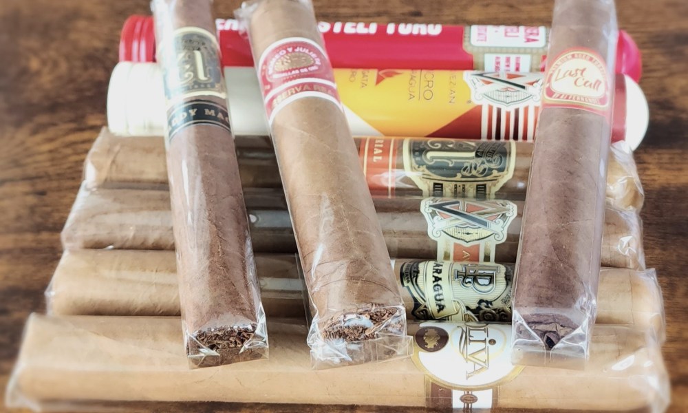 Bundle of cigars on the table from Briley Kenney | The Manual.