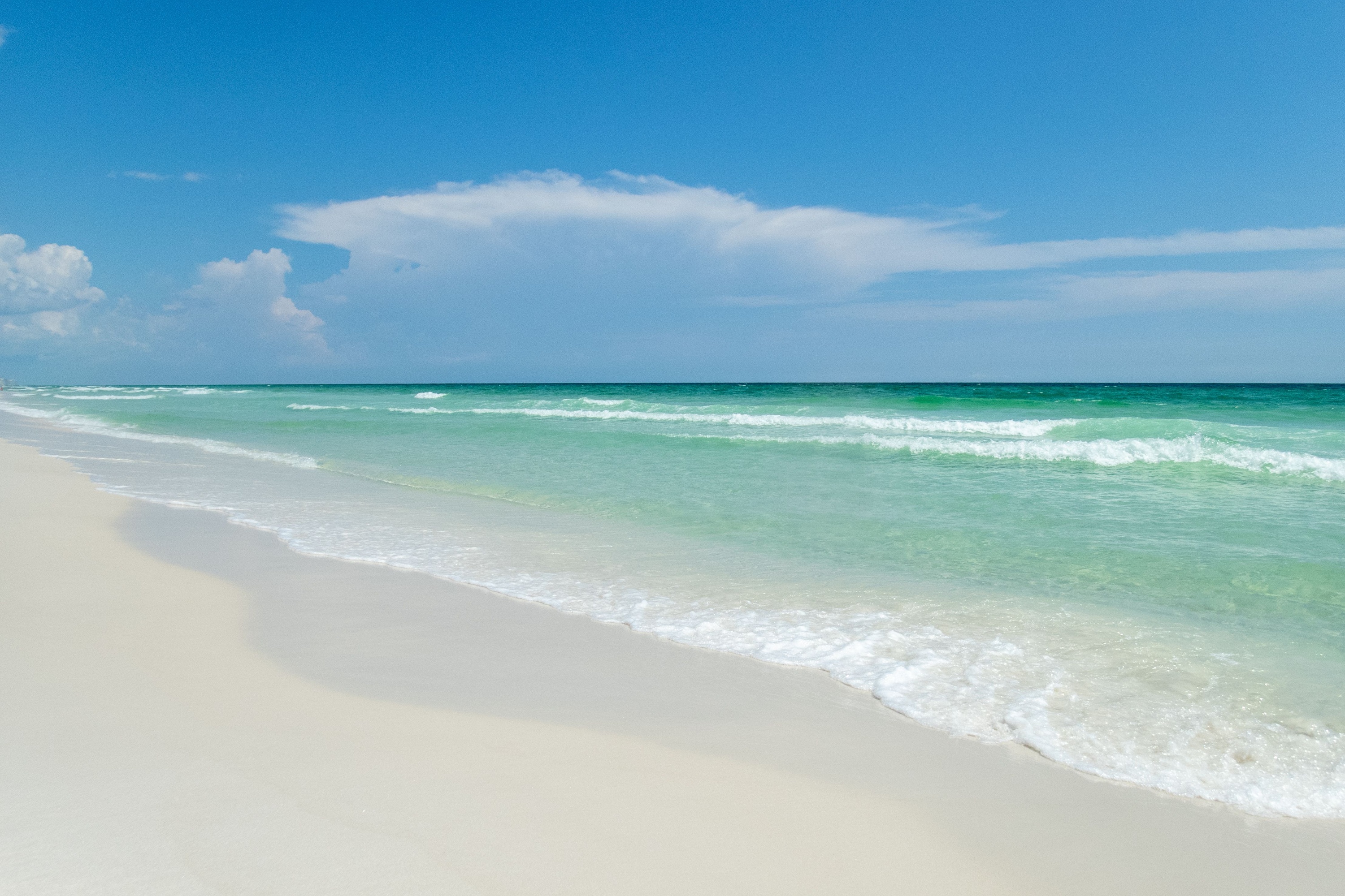 Blue skies, white sands and green waters on Florida’s Emerald Coast near Henderson Beach State Park and Destin Florida