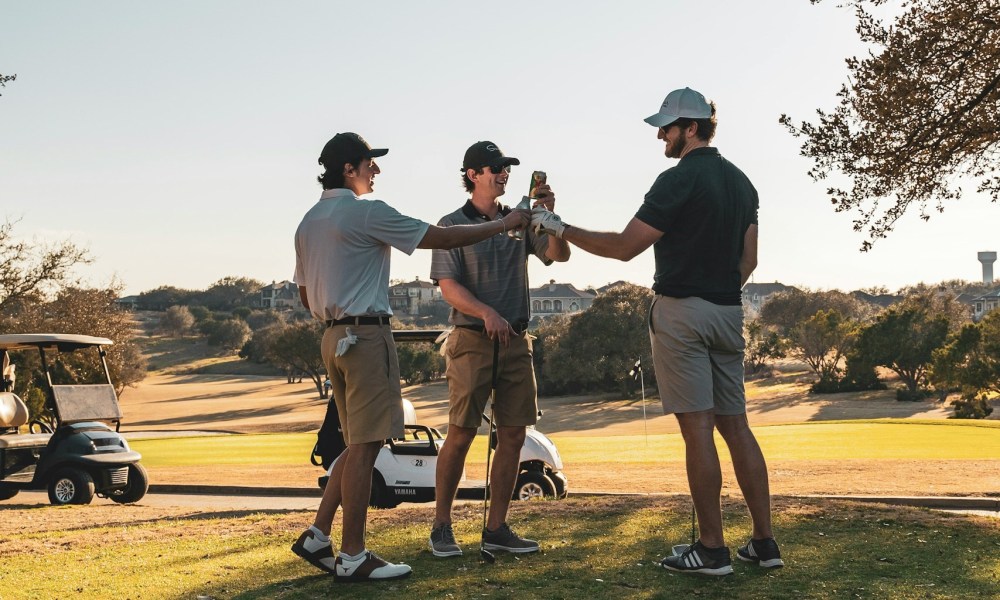 Men drinking and playing golf.