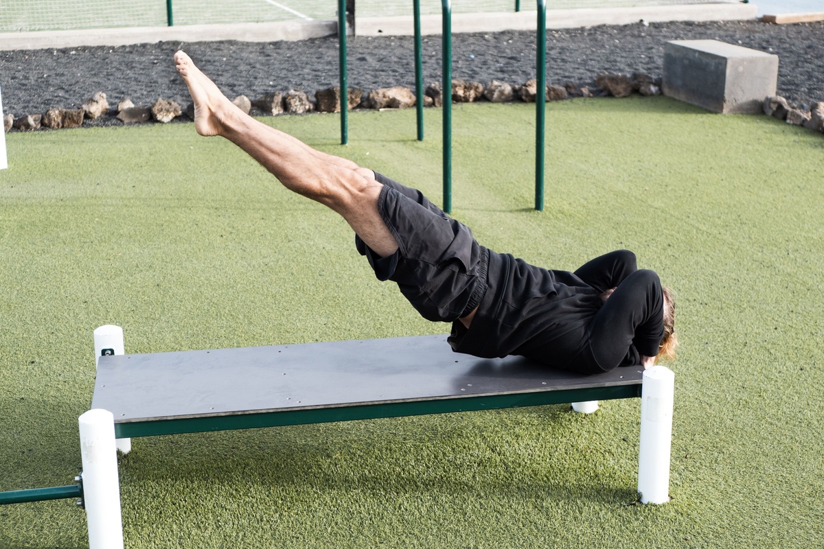 Man doing dragon flag.