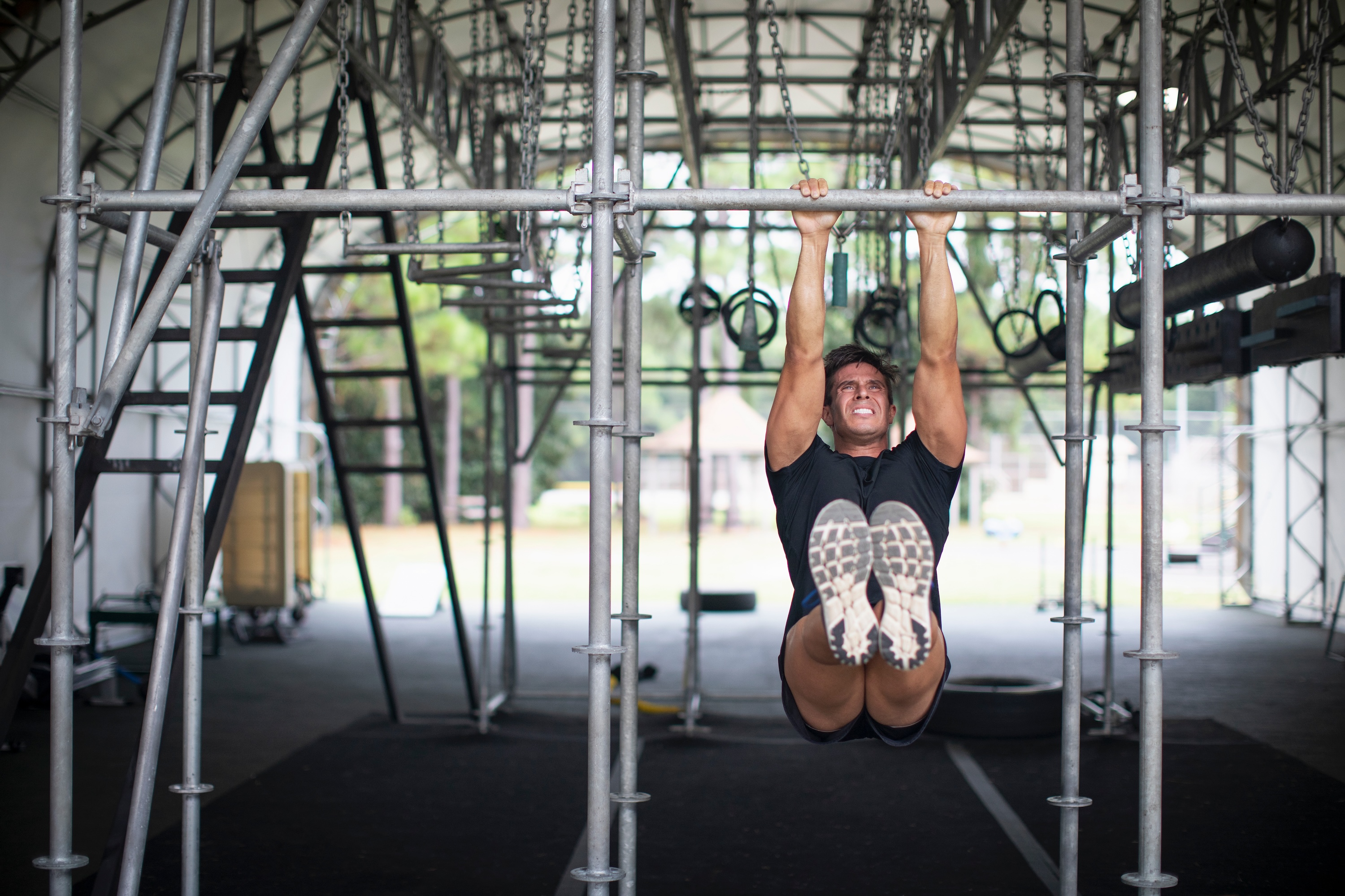 Man doing hanging hold exercises