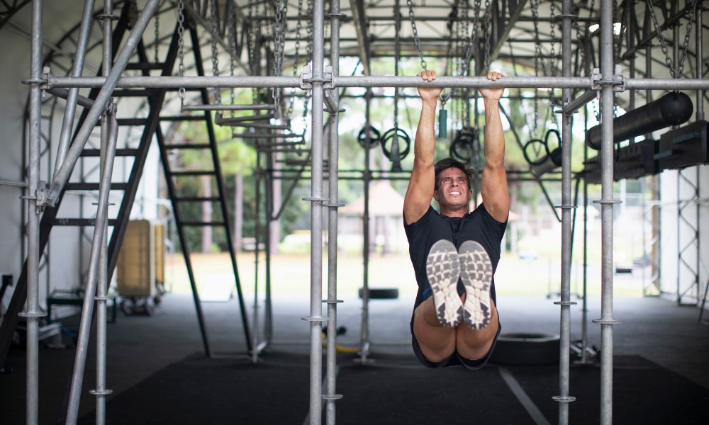 Man doing hanging hold exercises