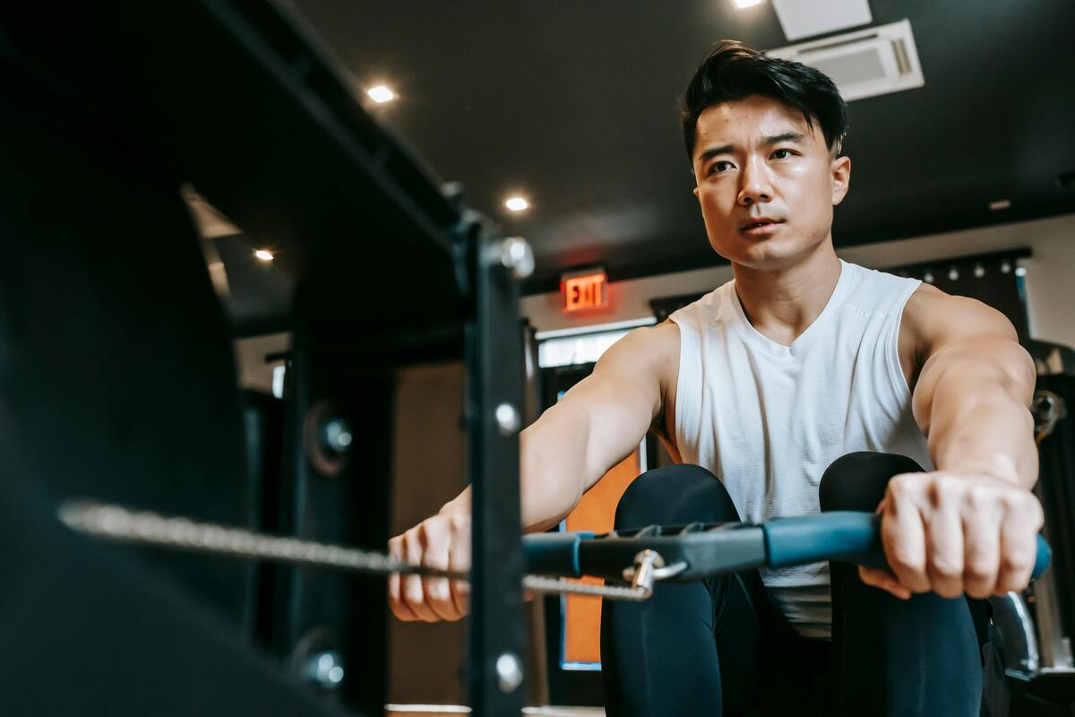 Man using a rowing machine.