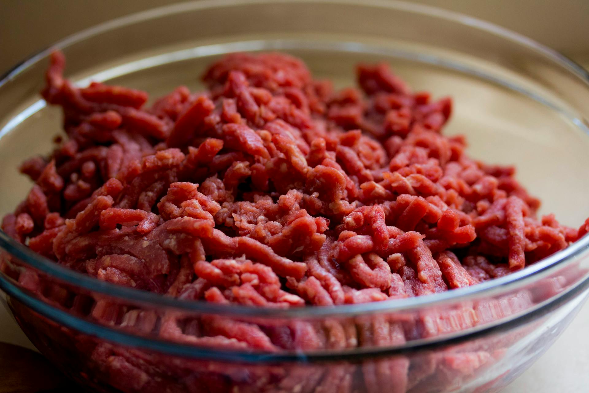 Ground beef in a glass bowl