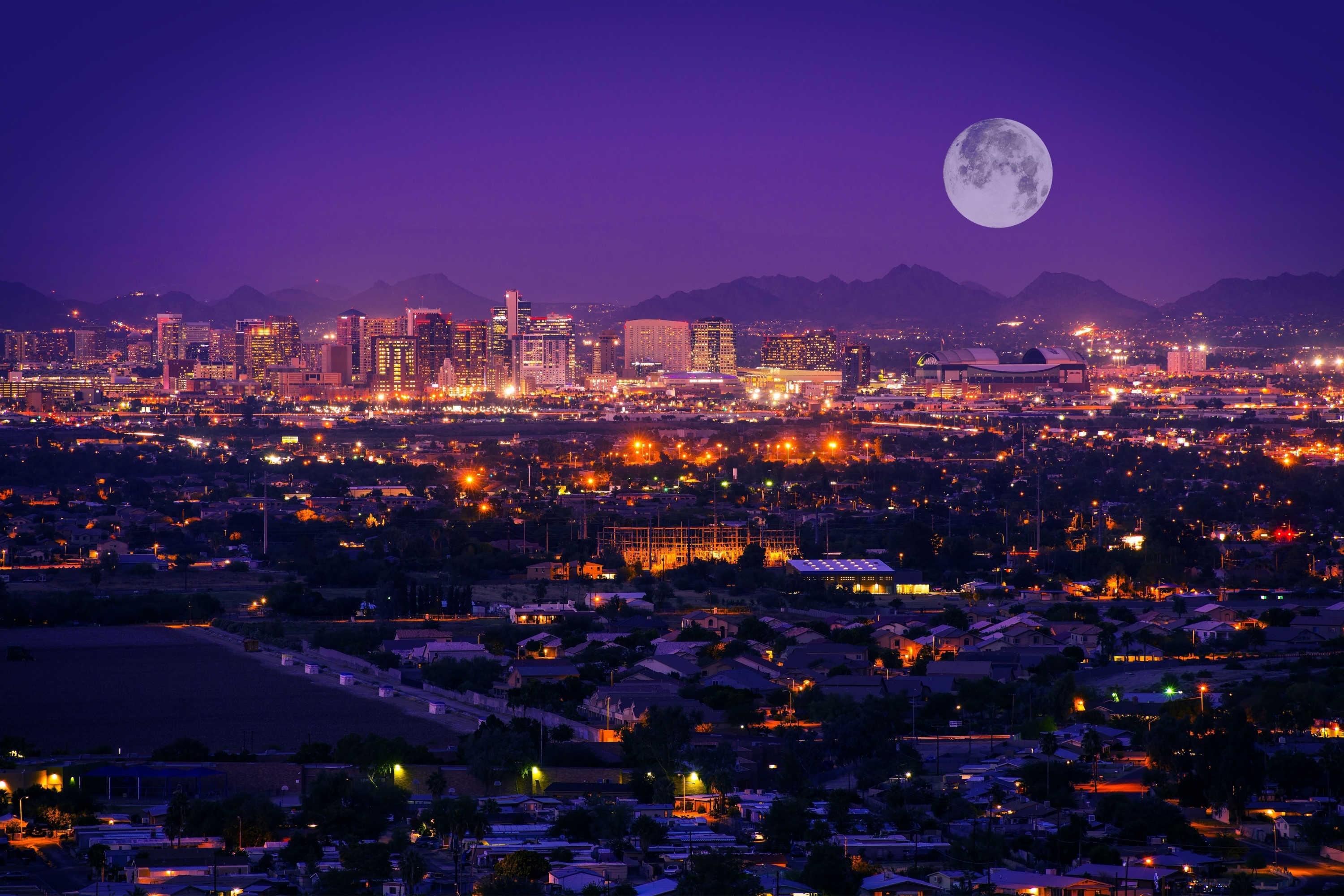 Phoenix Arizona Skyline at Night. Full Moon Over Phoenix, Arizona, United States.