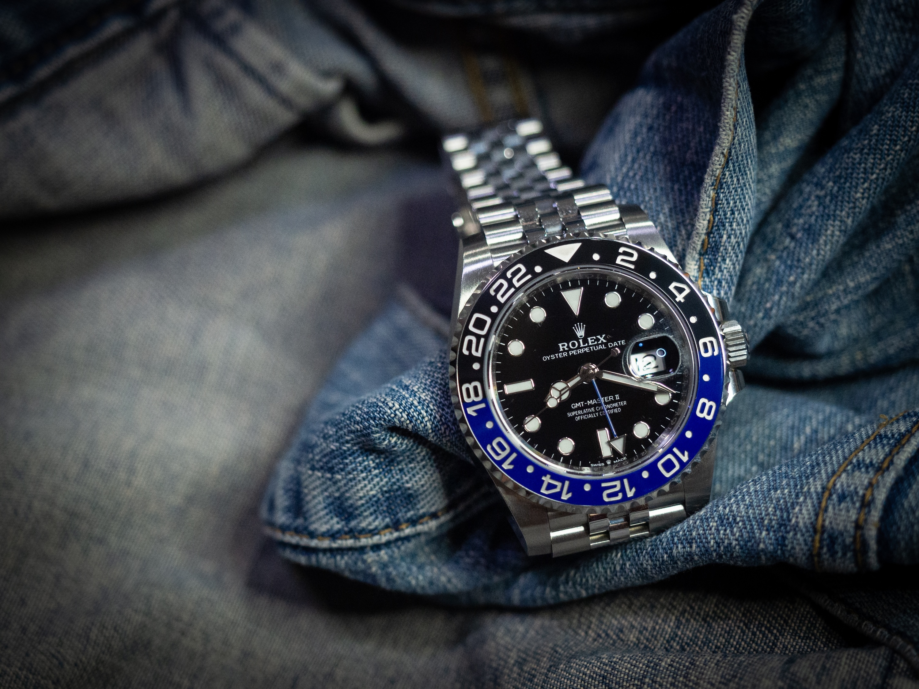 Rolex GMT Master 2 Blueblack(Batman) 126710BLNR. on jeans jacket background