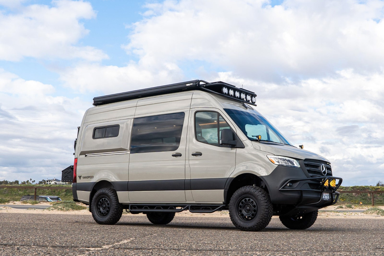 Vanspeed California Coast camper van parked in a parking lot.