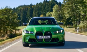 2025 BMW M3 Competition (European model) front view on a country road.