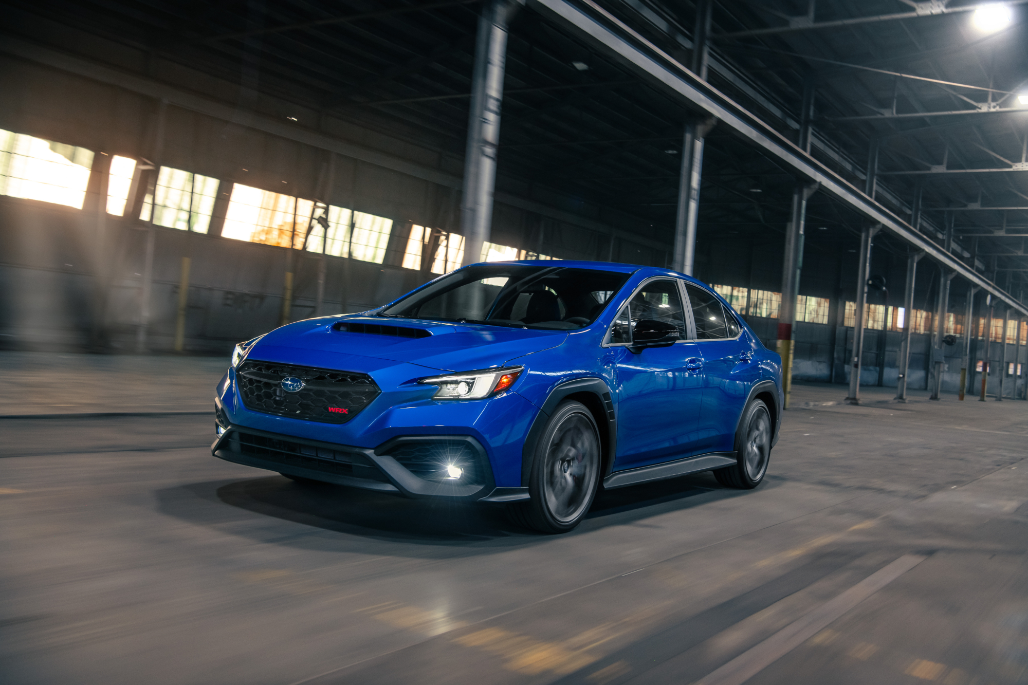 2025 Subaru WRX TS left front three-quarter view inside a warehouse.