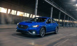 2025 Subaru WRX TS left front three-quarter view inside a warehouse.