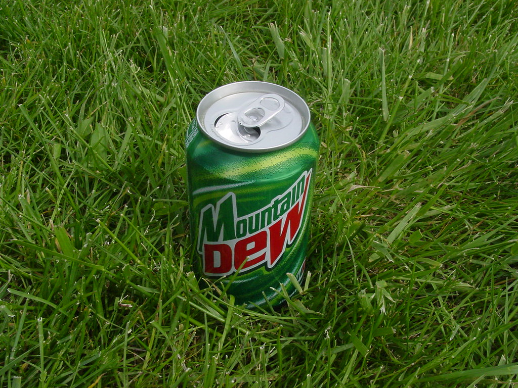 Mountain Dew can in grass