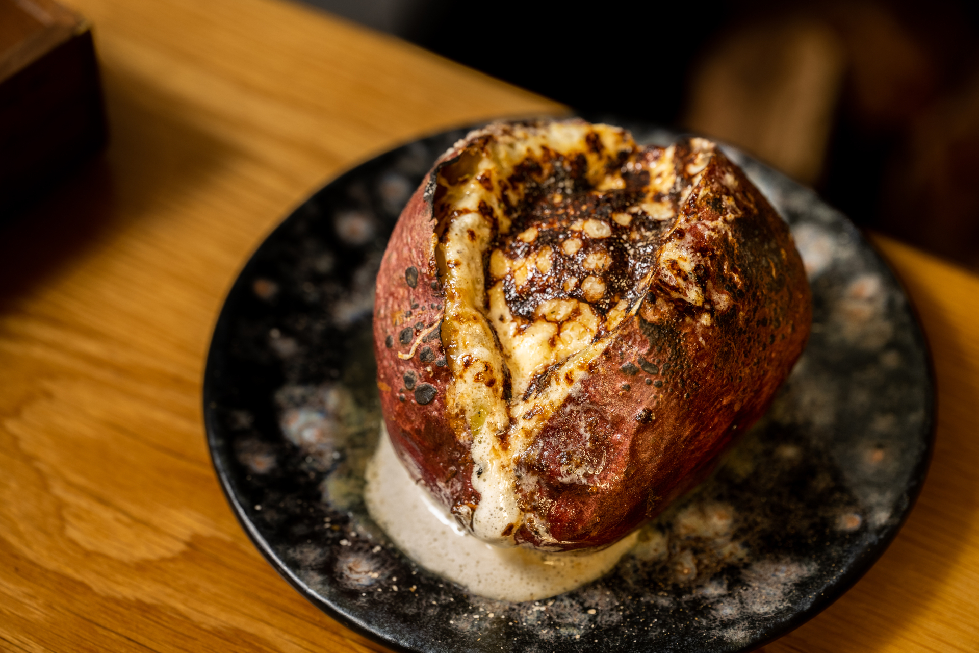 Japanese sweet potato on black plate.