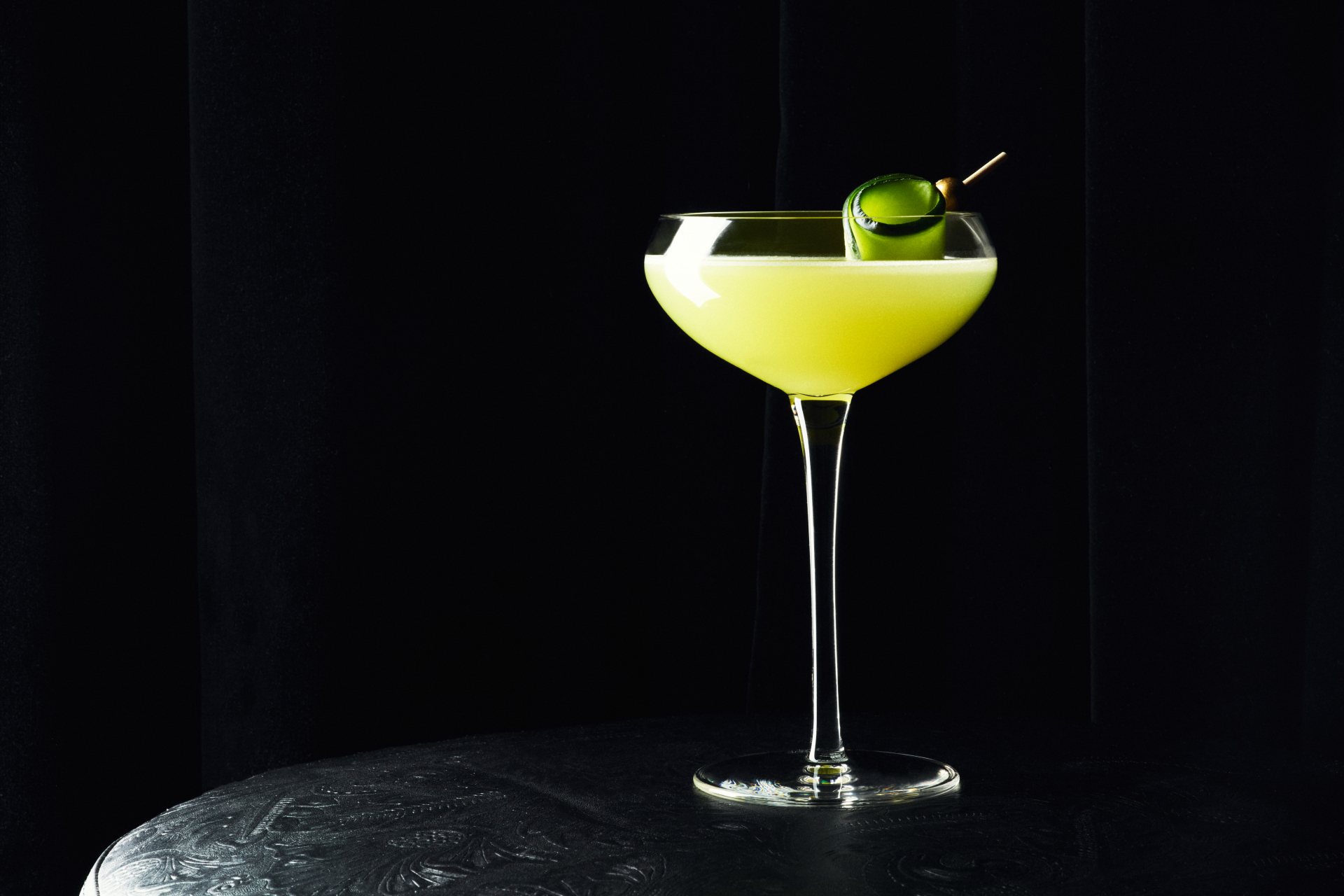 Green cocktail with black background