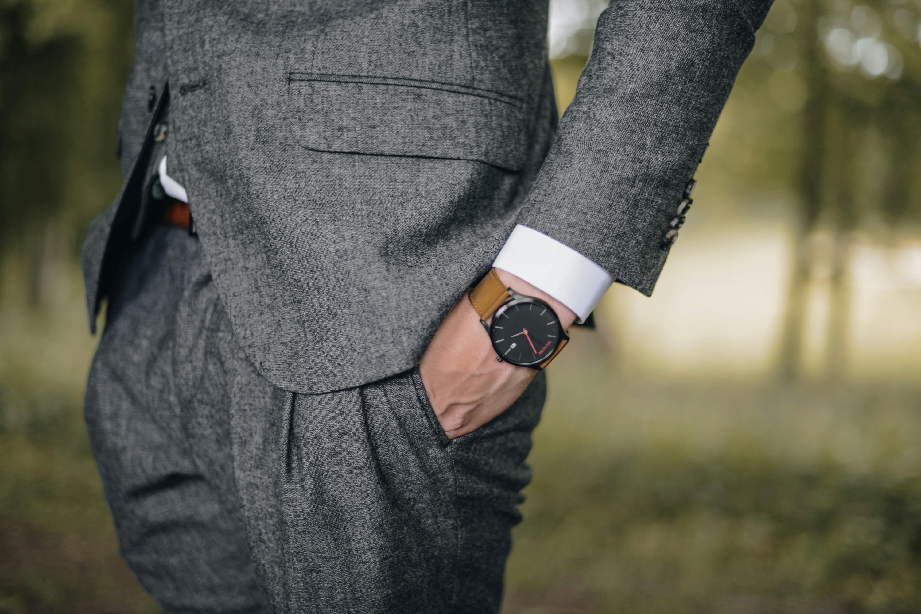 man in suit wearing a watch