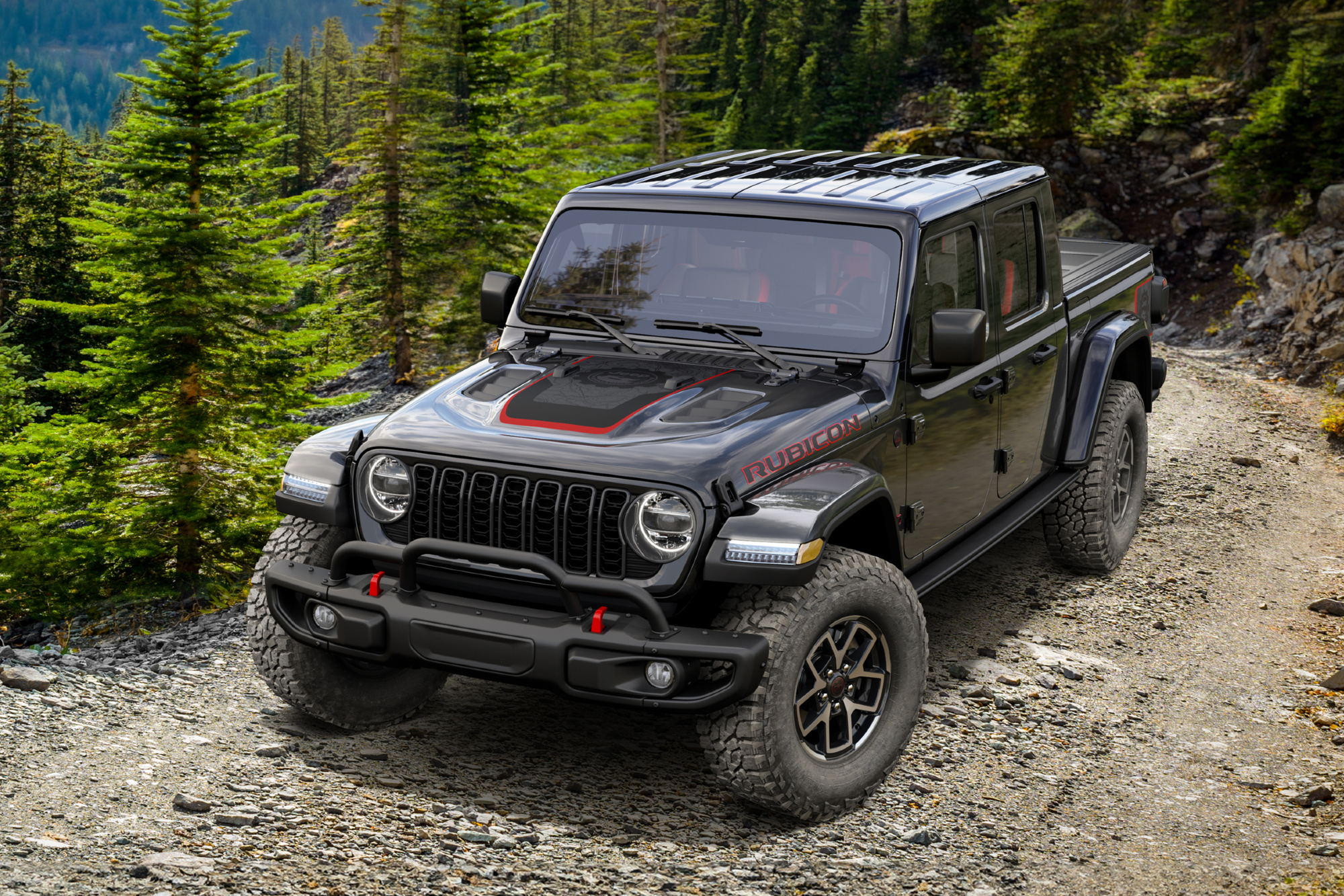 2024 Mopar Jeep Gladiator limited edition driving toward the viewer on a rocky road in the mountains.