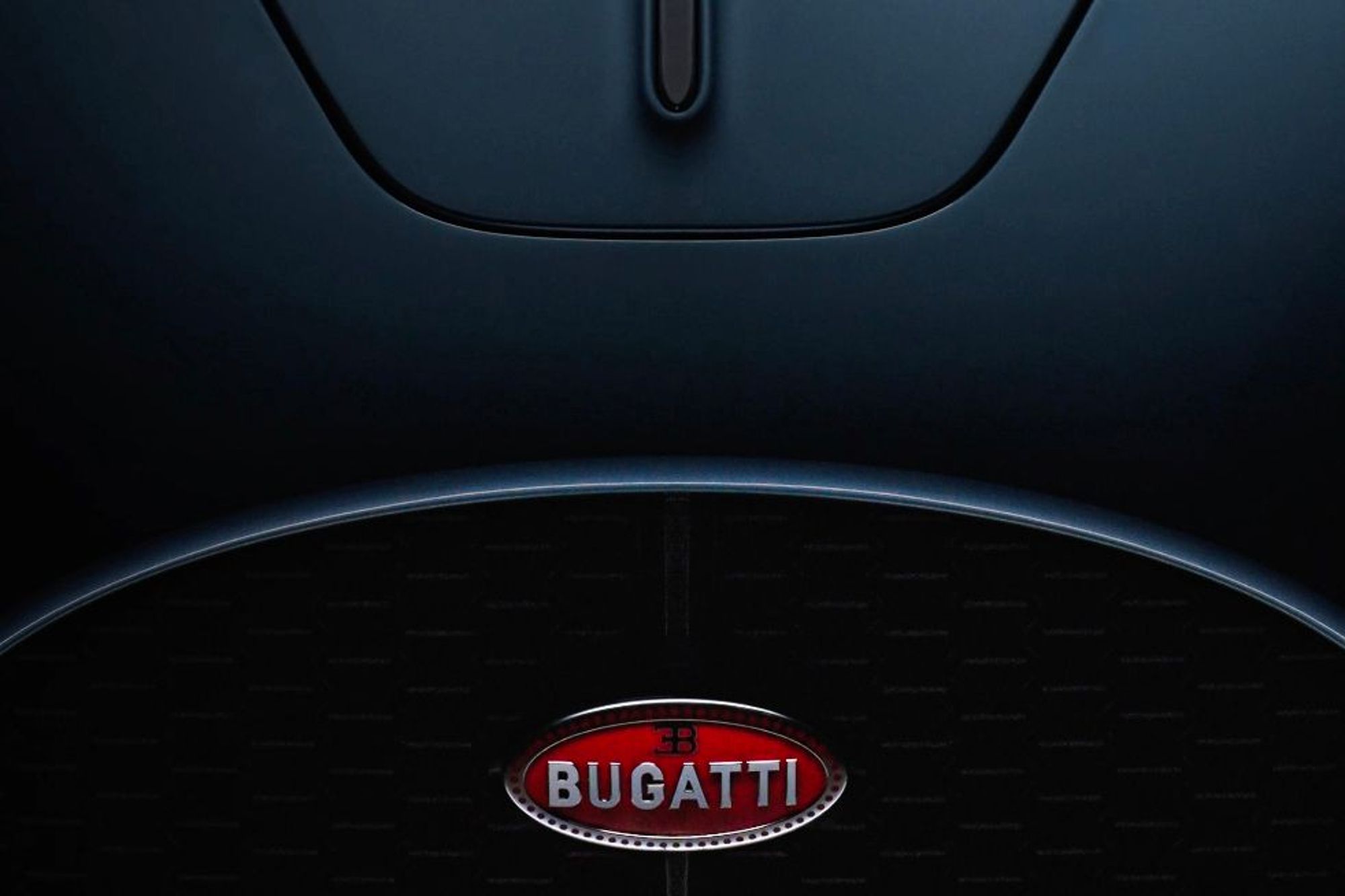 Bugatti hypercar hood with logo.