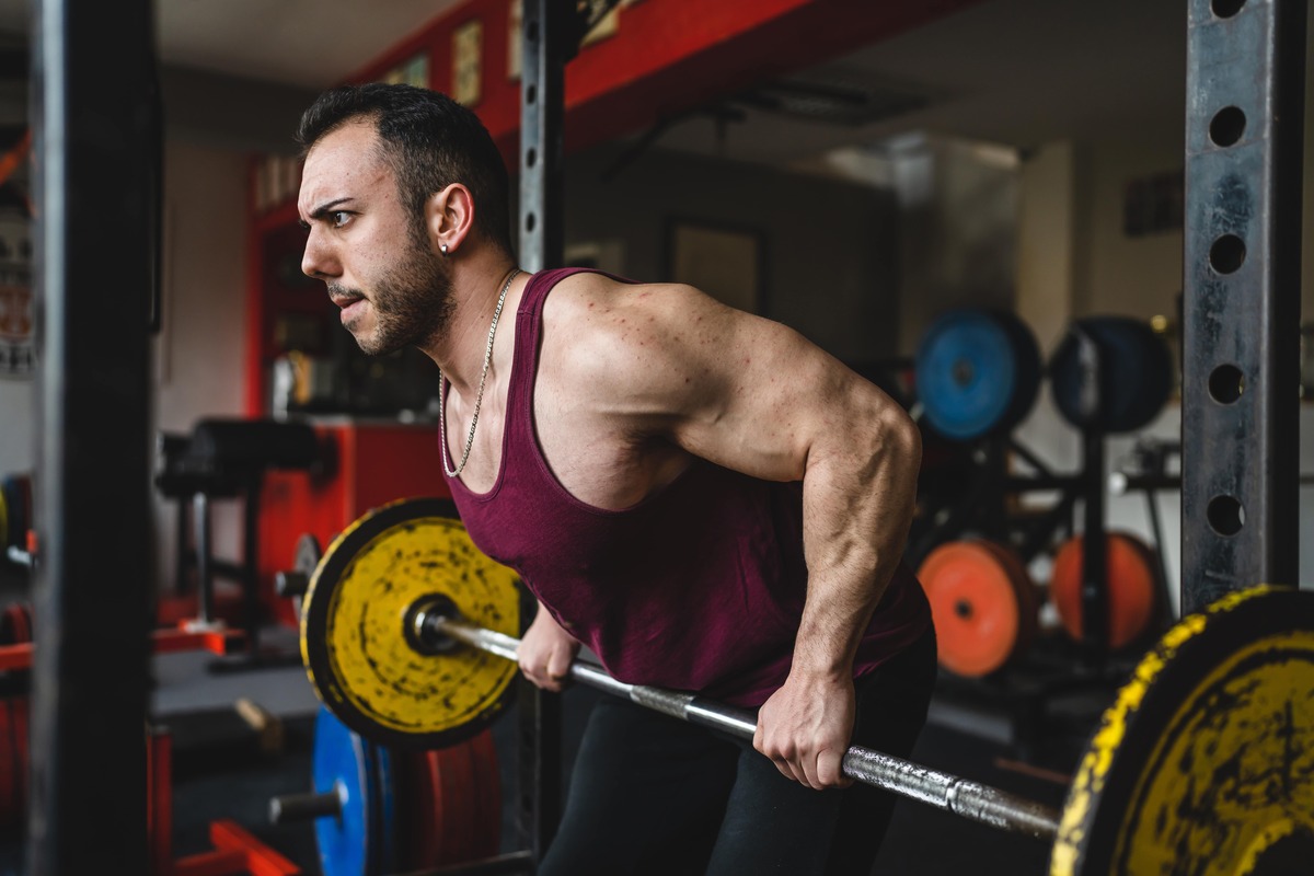 Man doing barbell rows.