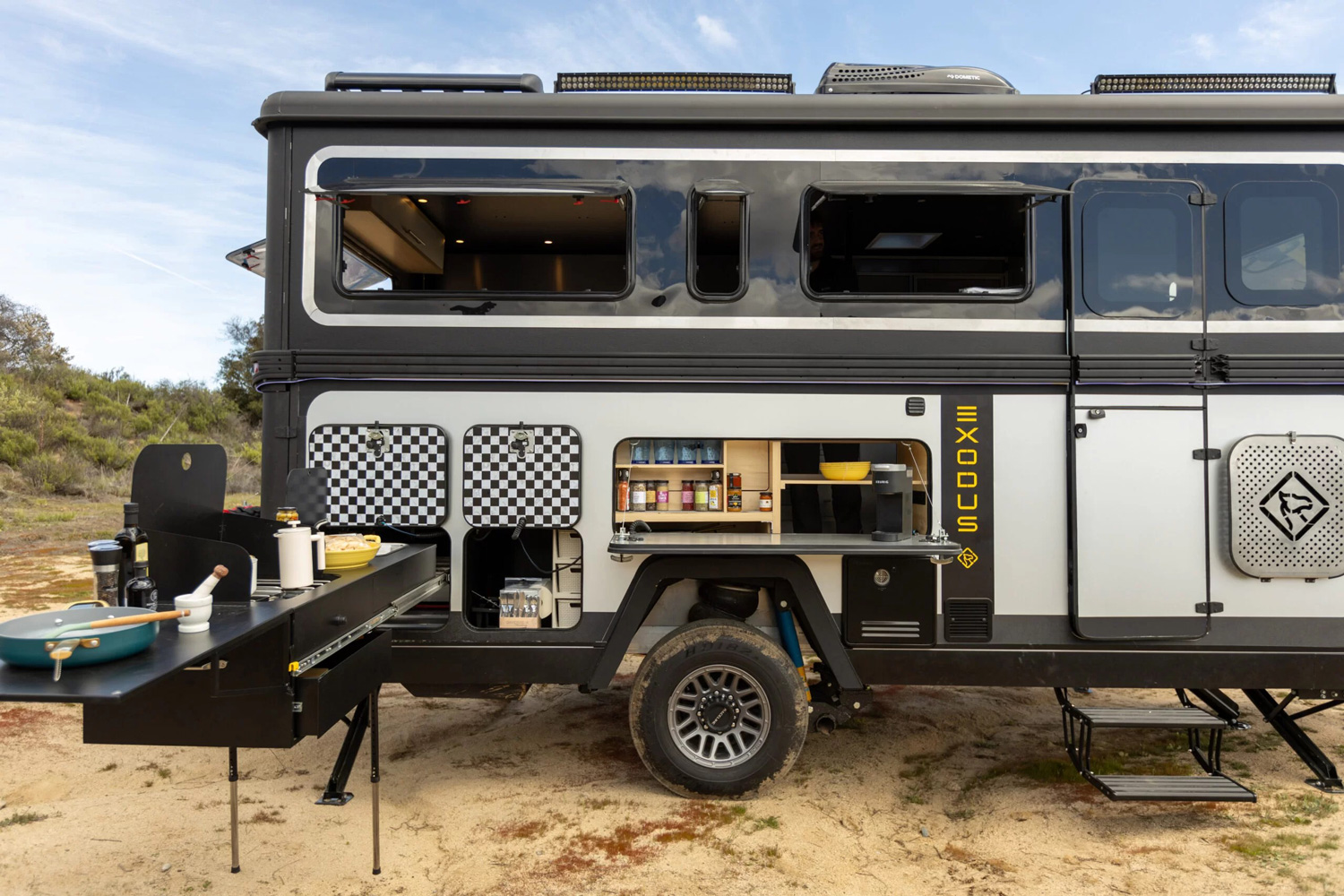 Exodus Capax travel trailer setup at camp in the desert.