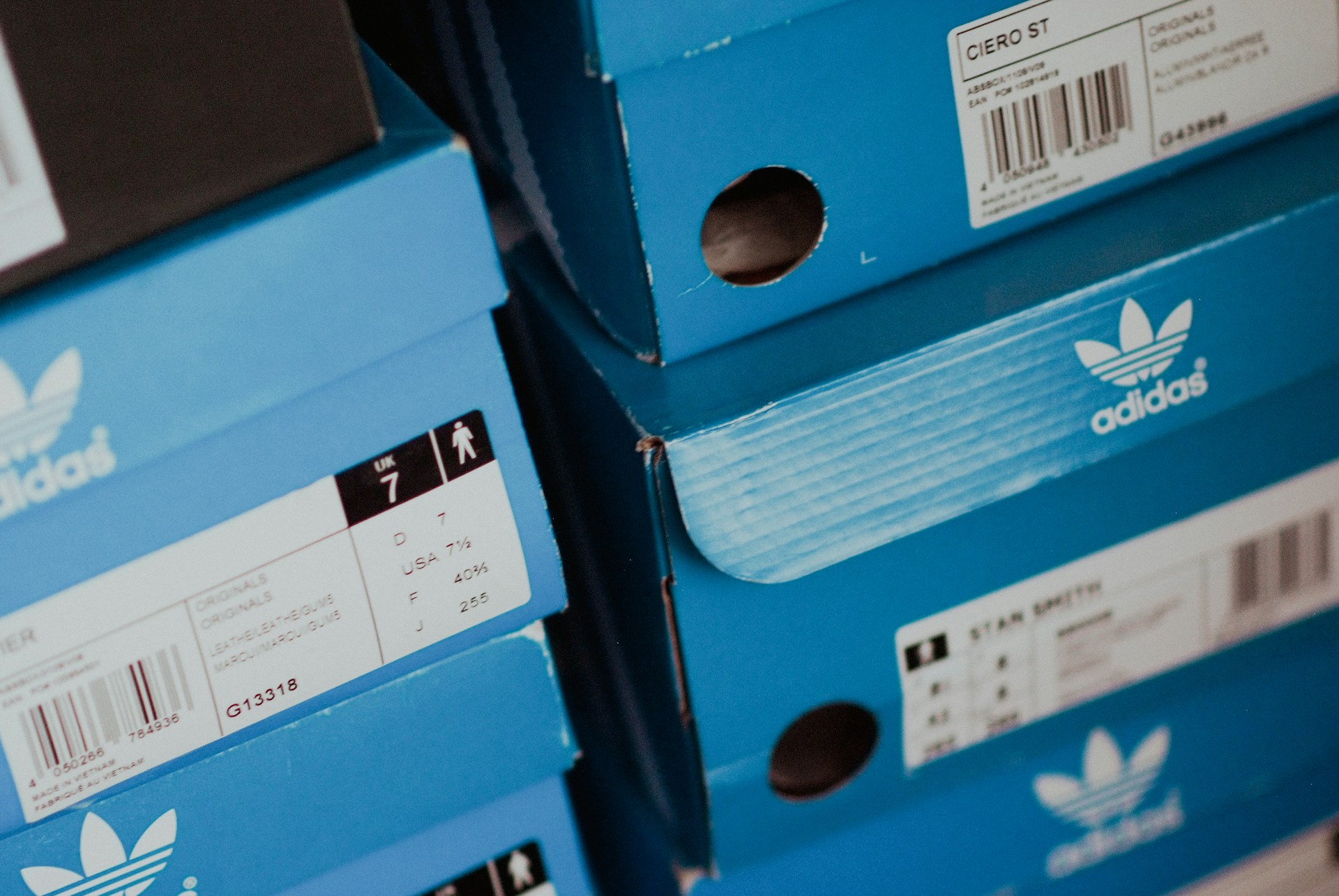 Blue and white Adidas shoe boxes