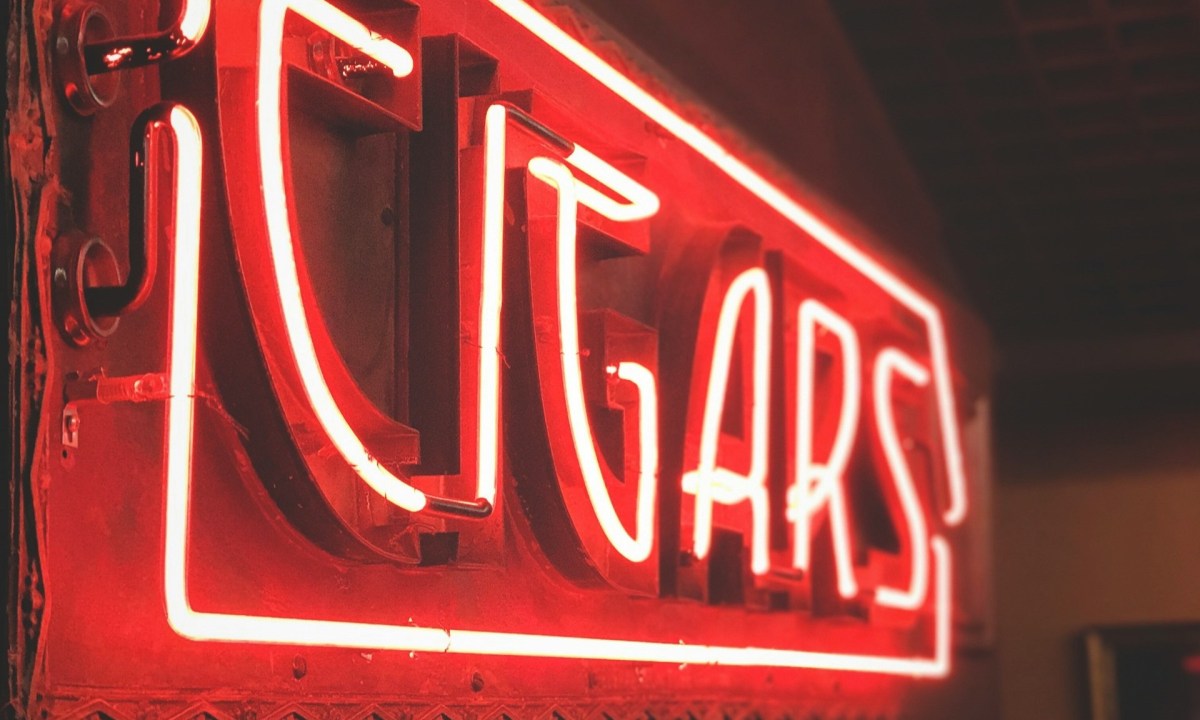 Red Neon Sign signaling cigar bar.