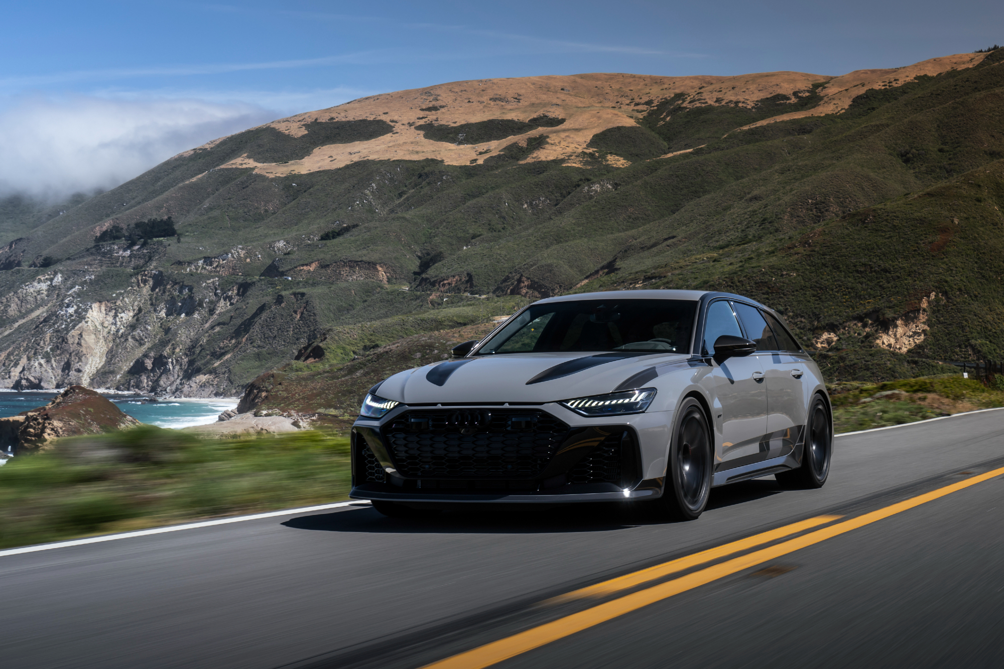 2025 Audi RS 6 Avant GT in Nardo Gray driving along California coastline.