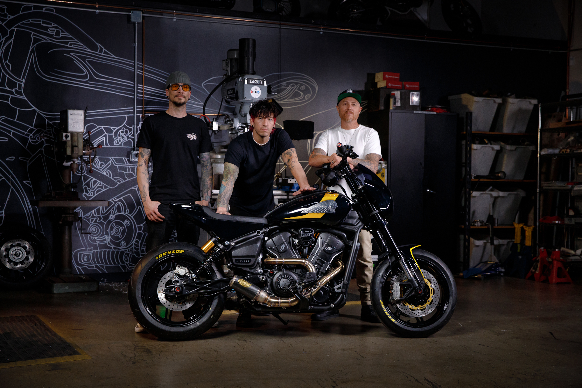 Aaron Boss, Twenty One Pilots drummer Josh Dun, and Roland Sands with Dun's rowdy new Roland Sands Design custom Indian Scout.