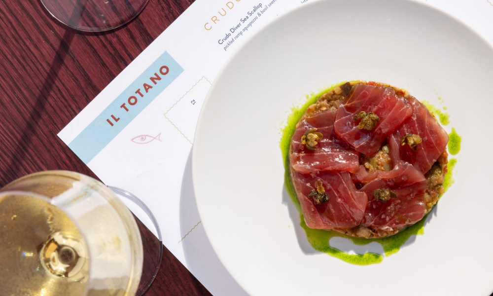 Dry-aged tuna crudo on a white plate