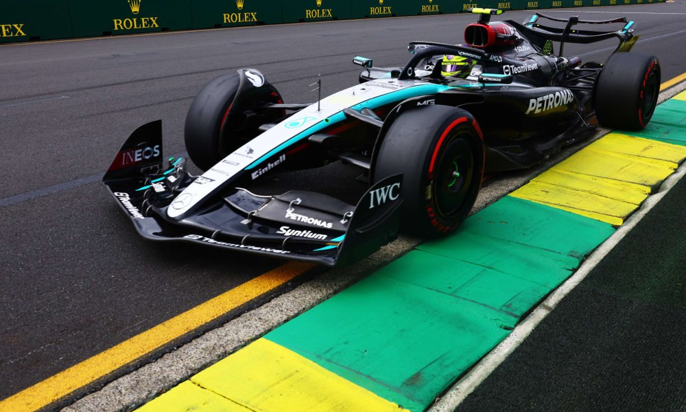 George Russell in Mercedes-AMG Petronas Formula 1 race car three-quarter view.