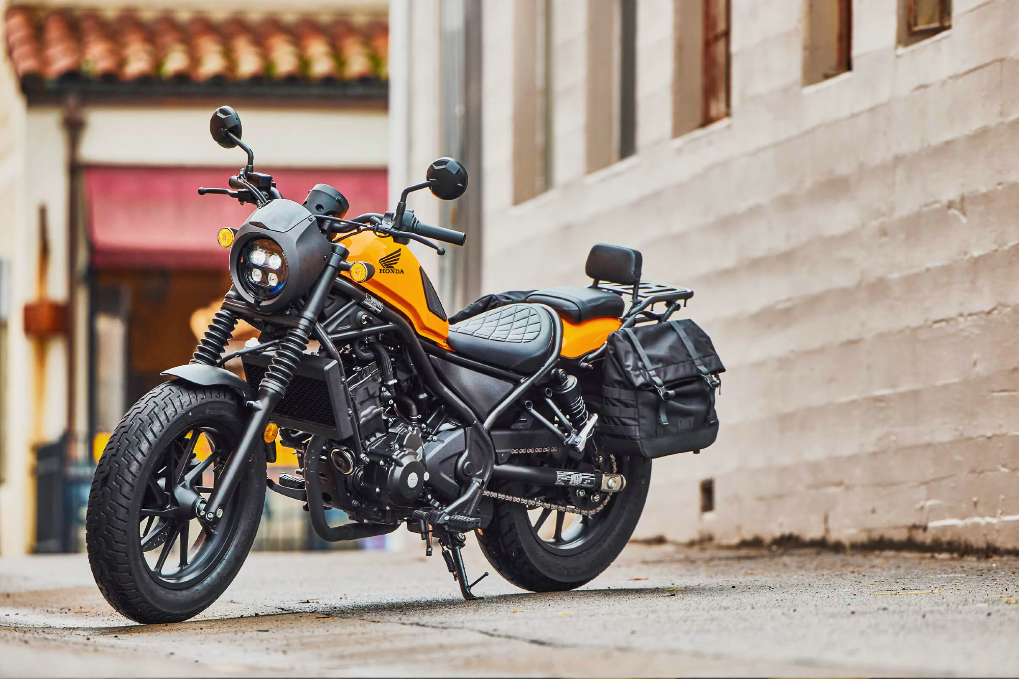 Honda Rebel 300 with optional rack, bags, and pilon.