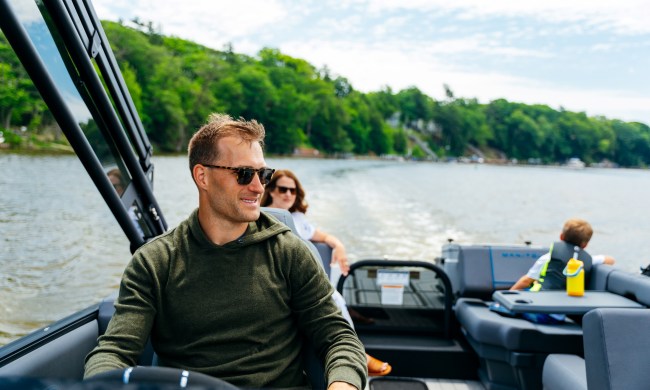 Kirk Cousins driving a boat