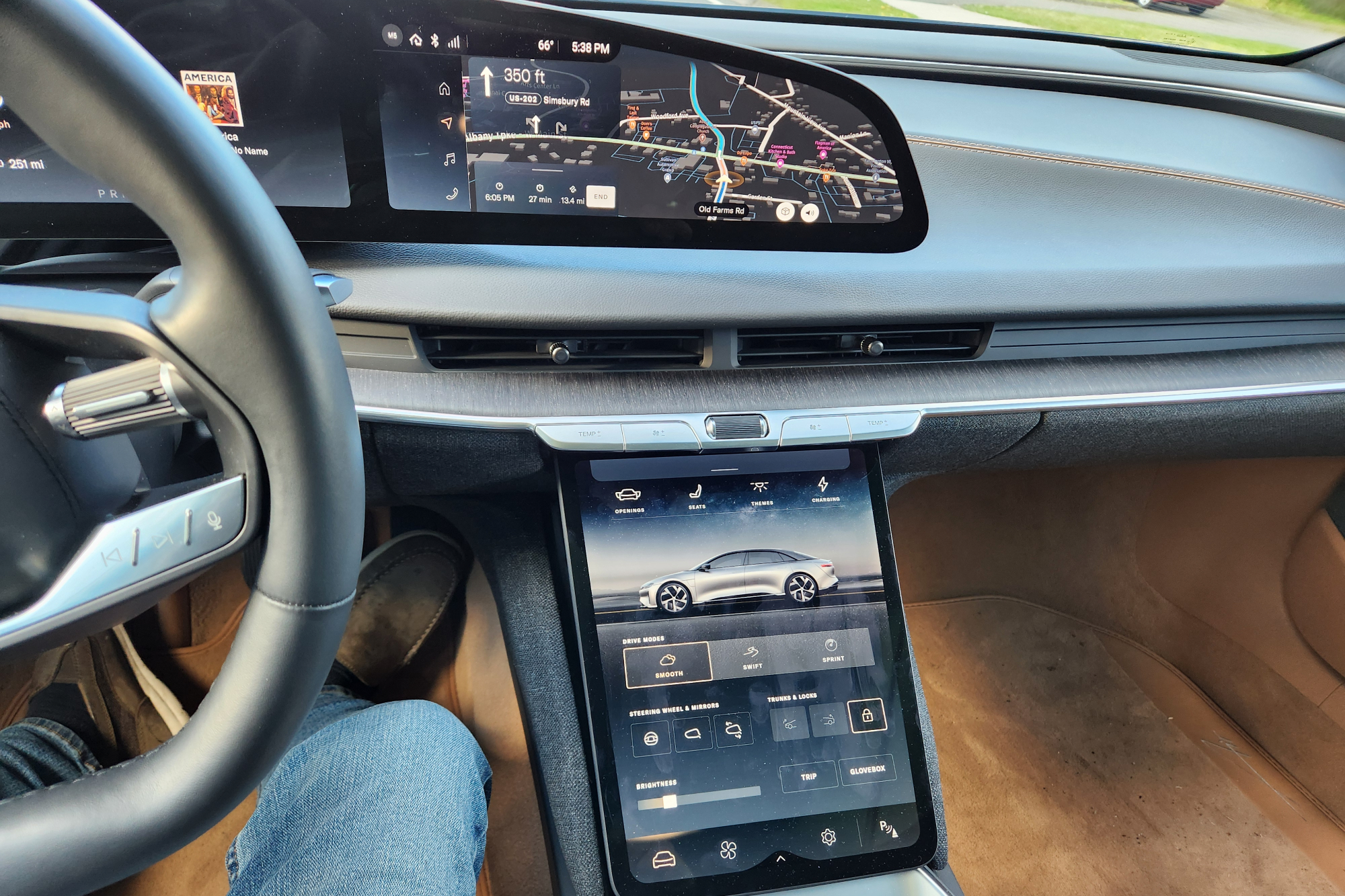 Lucid Air Touring EV owners manual on the console display with navigation on the dashboard display