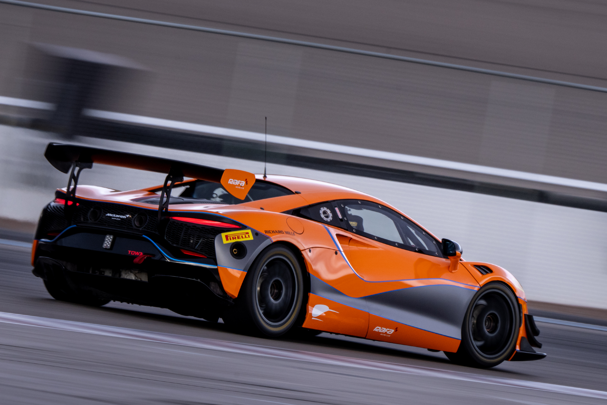 McLaren Arturo Trophy race car on the track closeup.